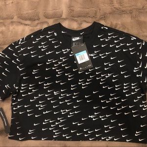 Nike crop t-shirt. Multiple mini swooshes.